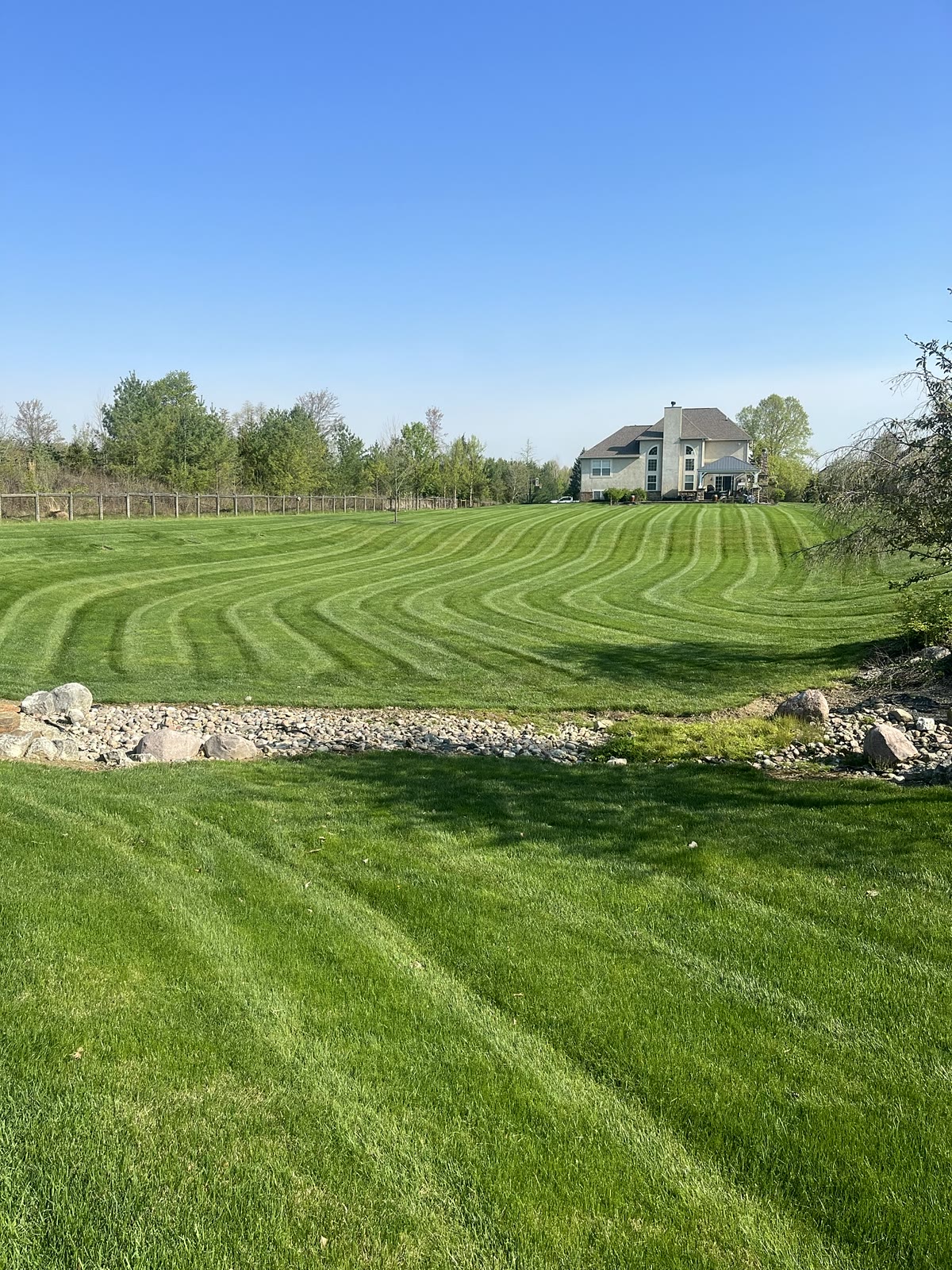 Curved stripes along a stone border
